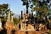 Inle Lake Myanmar. Indein, on the summit of a hill the  Shwe Inn Thein Paya a cluster of hundreds of ancient stupas. Many of them are ruined and overgrown with bushes. 